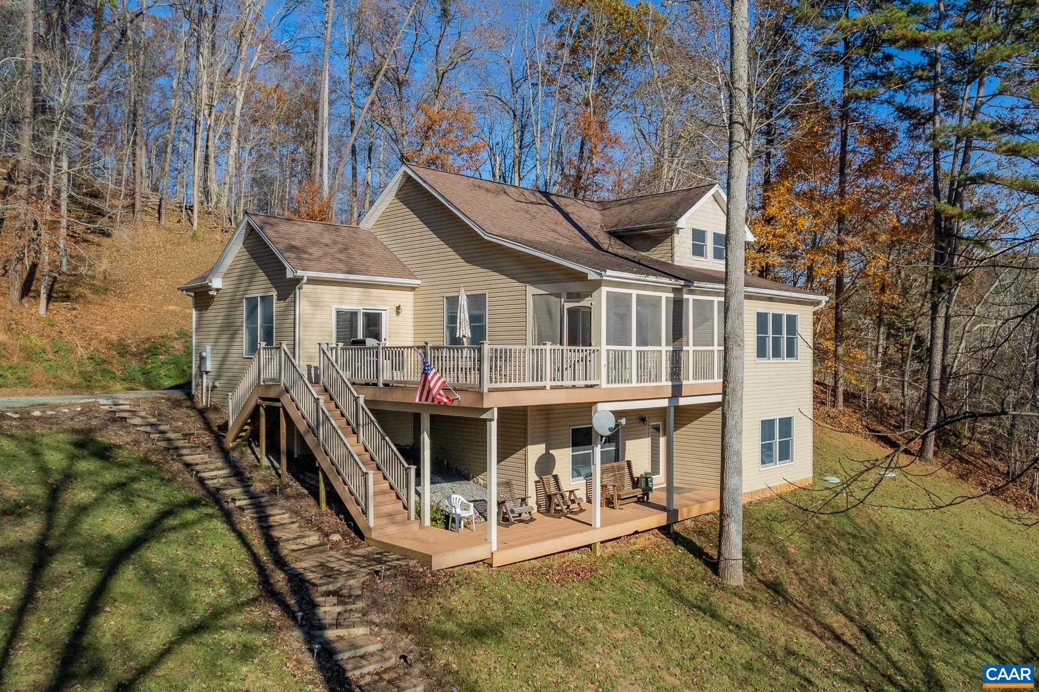 909 Gap Bridge Road Moneta, VA 24121 - Photo 4 of 75 a view of a house with wooden deck front of house