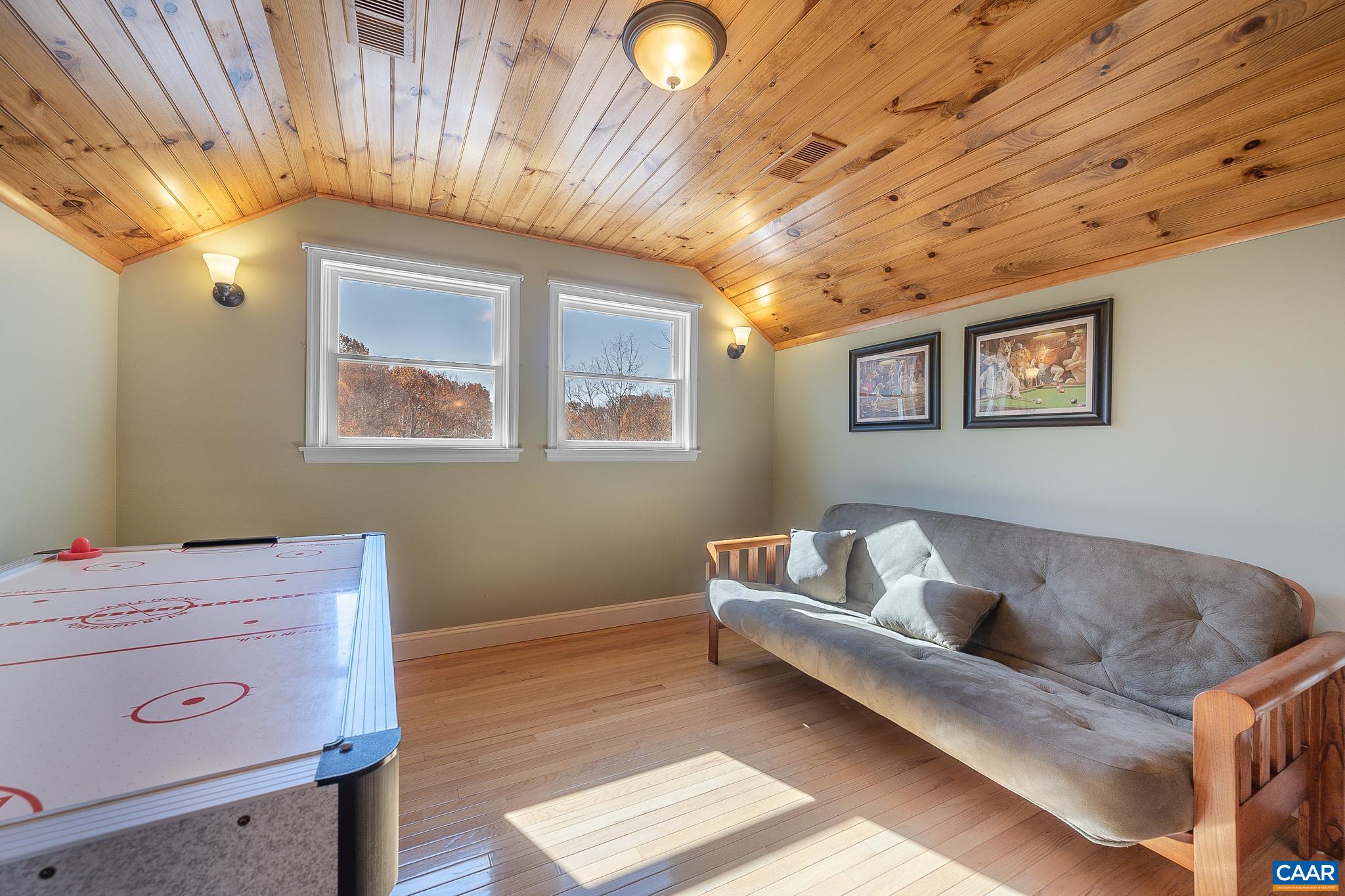 909 Gap Bridge Road Moneta, VA 24121 - Photo 51 of 75 a living room with furniture and a baby crib
