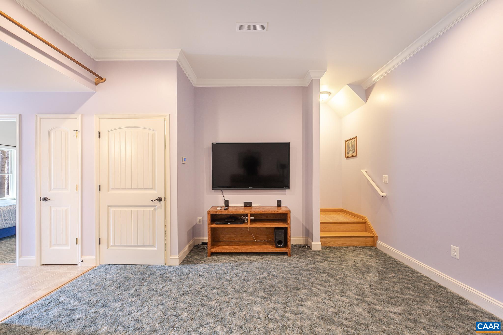 909 Gap Bridge Road Moneta, VA 24121 - Photo 54 of 75 a bedroom with furniture and flat screen tv