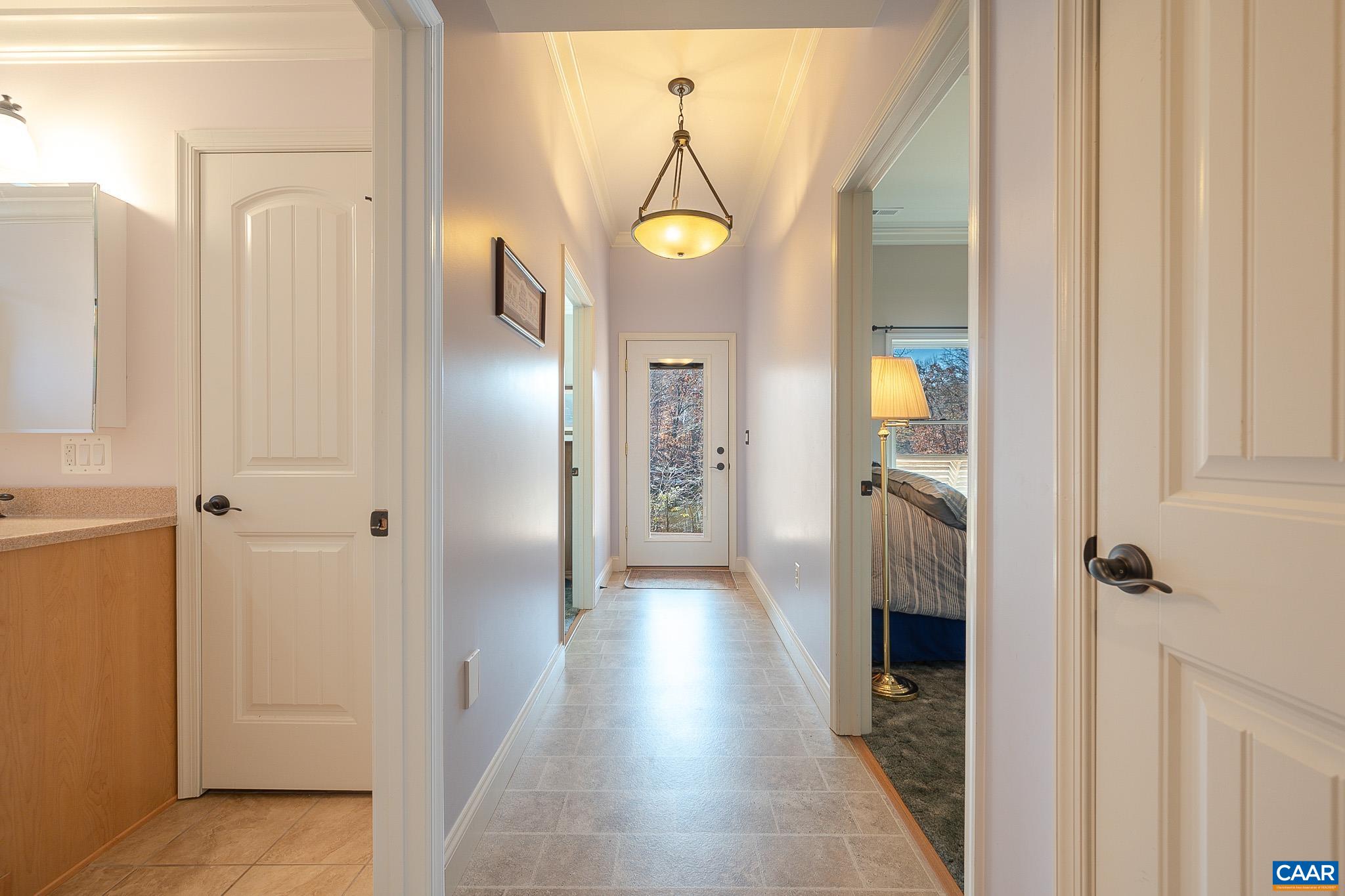909 Gap Bridge Road Moneta, VA 24121 - Photo 56 of 75 a view of a hallway with wooden floor windows and a livingroom