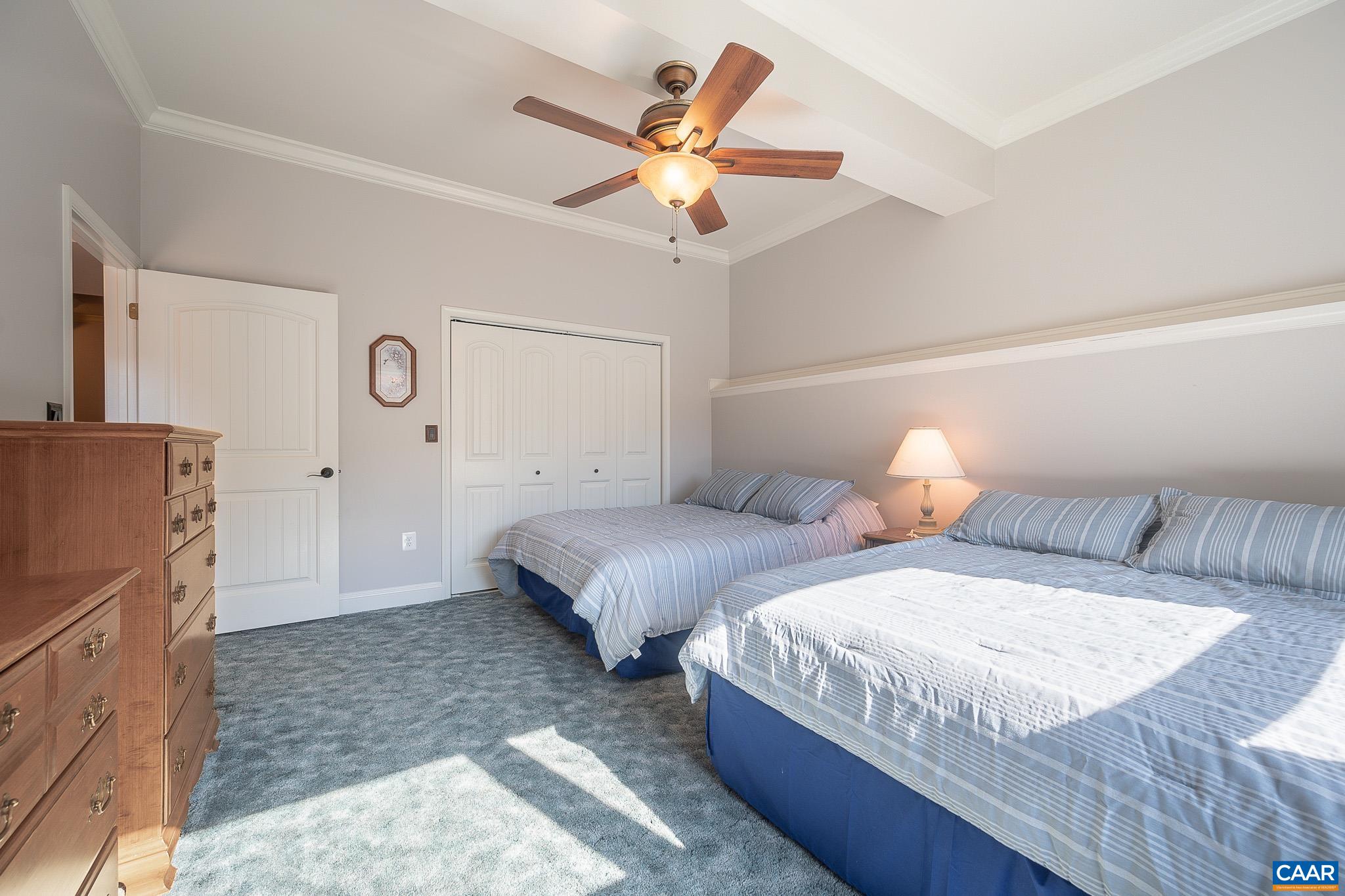 909 Gap Bridge Road Moneta, VA 24121 - Photo 63 of 75 a bedroom with two beds and a ceiling fan