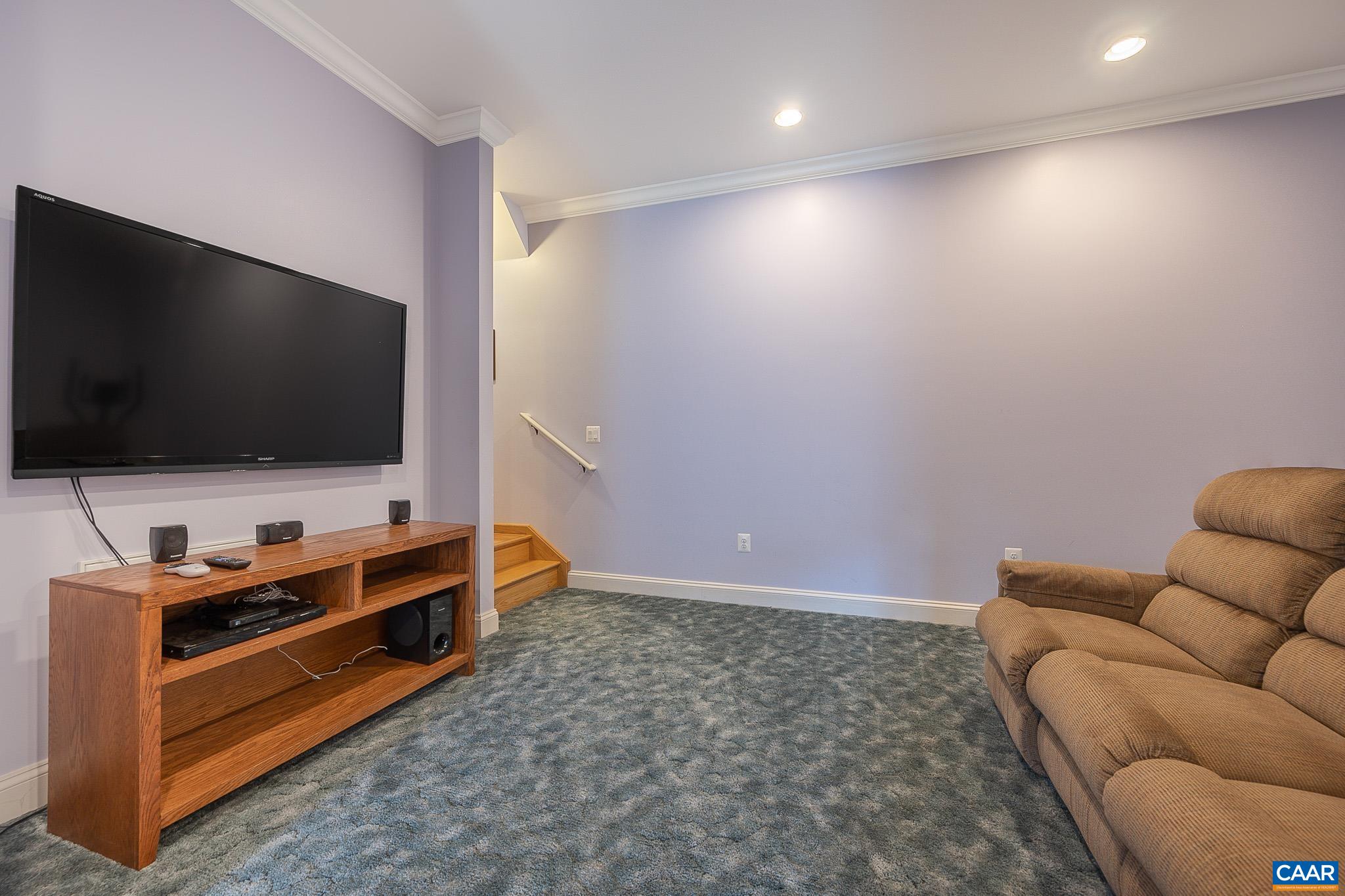 909 Gap Bridge Road Moneta, VA 24121 - Photo 64 of 75 a living room with furniture and a flat screen tv
