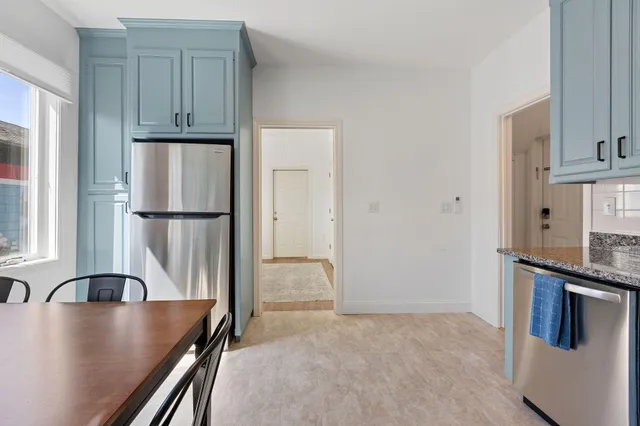 a view of a dining room with furniture and window