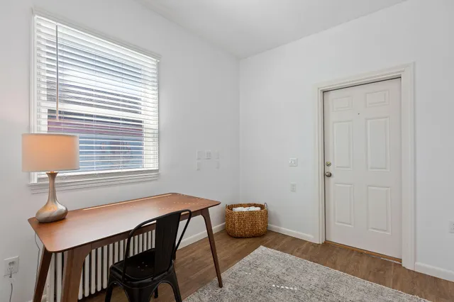 a bedroom with bed and a window