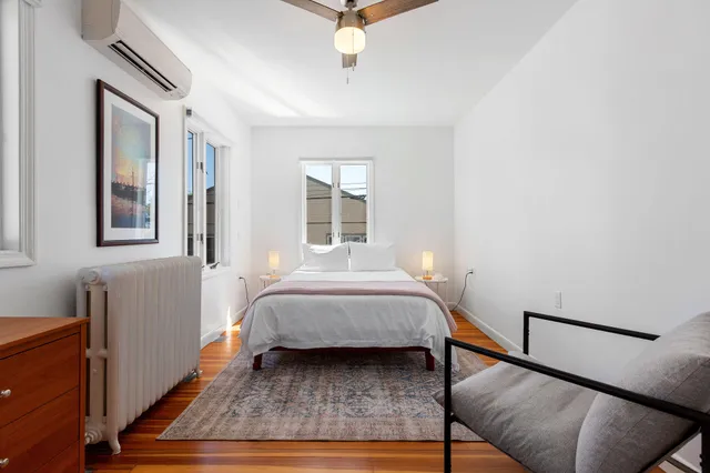 a bedroom with furniture and windows