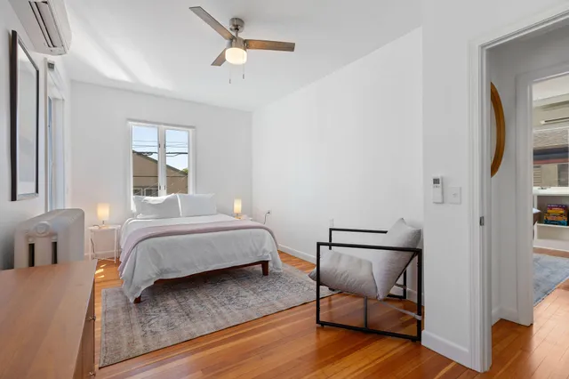 a bathroom with a toilet and a bathtub