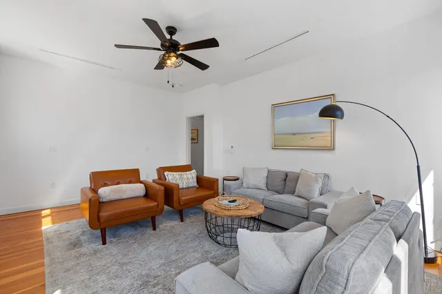 a living room with furniture and a rug