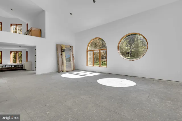 a view of a livingroom with furniture and window