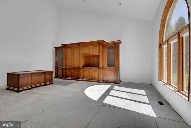 a view of a room with furniture and a window