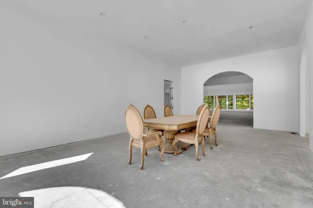 a dining room with furniture and a toilet
