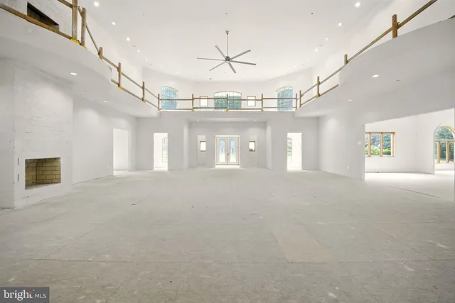 a view of a hallway with chandelier