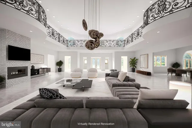 a living room with furniture a chandelier and a flat screen tv