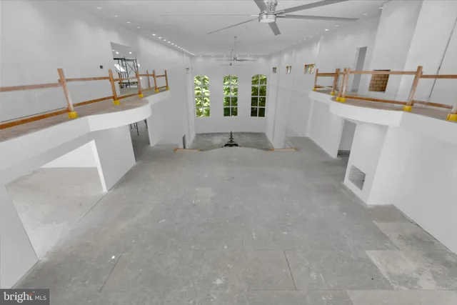 a view of a hallway with a kitchen