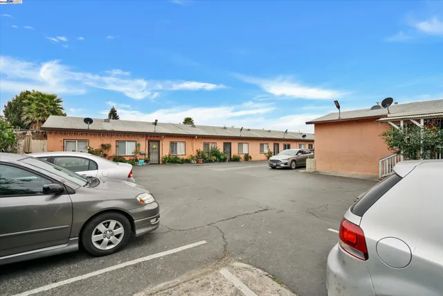 a front view of a house with parking