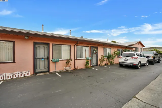 a view of a car park in front of house