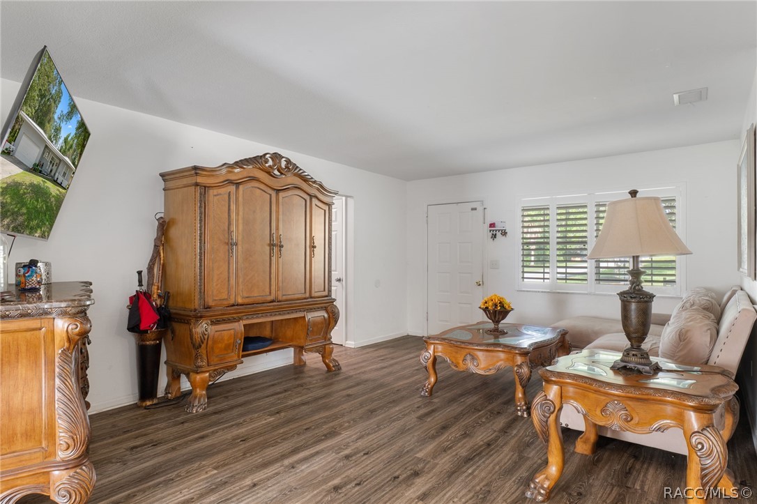 1140 South Highlands Avenue Inverness, FL 34452 - Photo 13 of 54 a living room with furniture and wooden floor