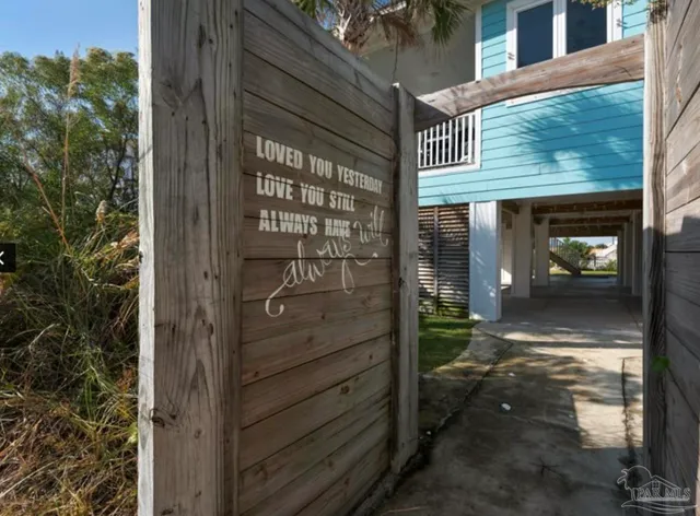 a view of a door and a street view