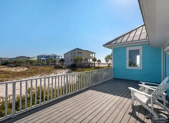 a view of a terrace with wooden floor and city view