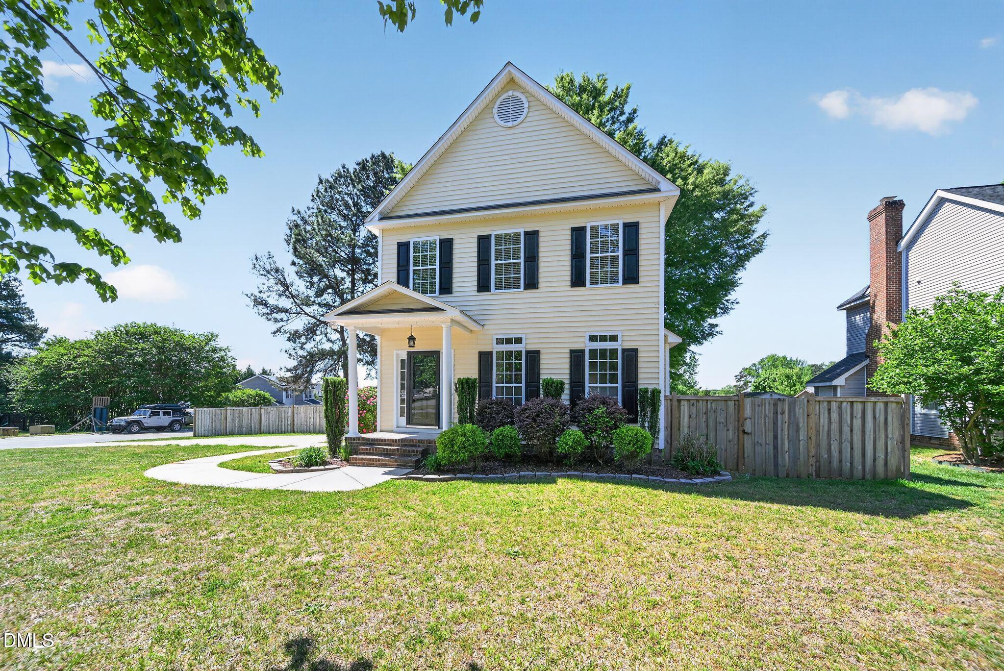 641 Commander Drive Wendell, NC 27591 - Photo 1 of 15 a front view of a house with garden