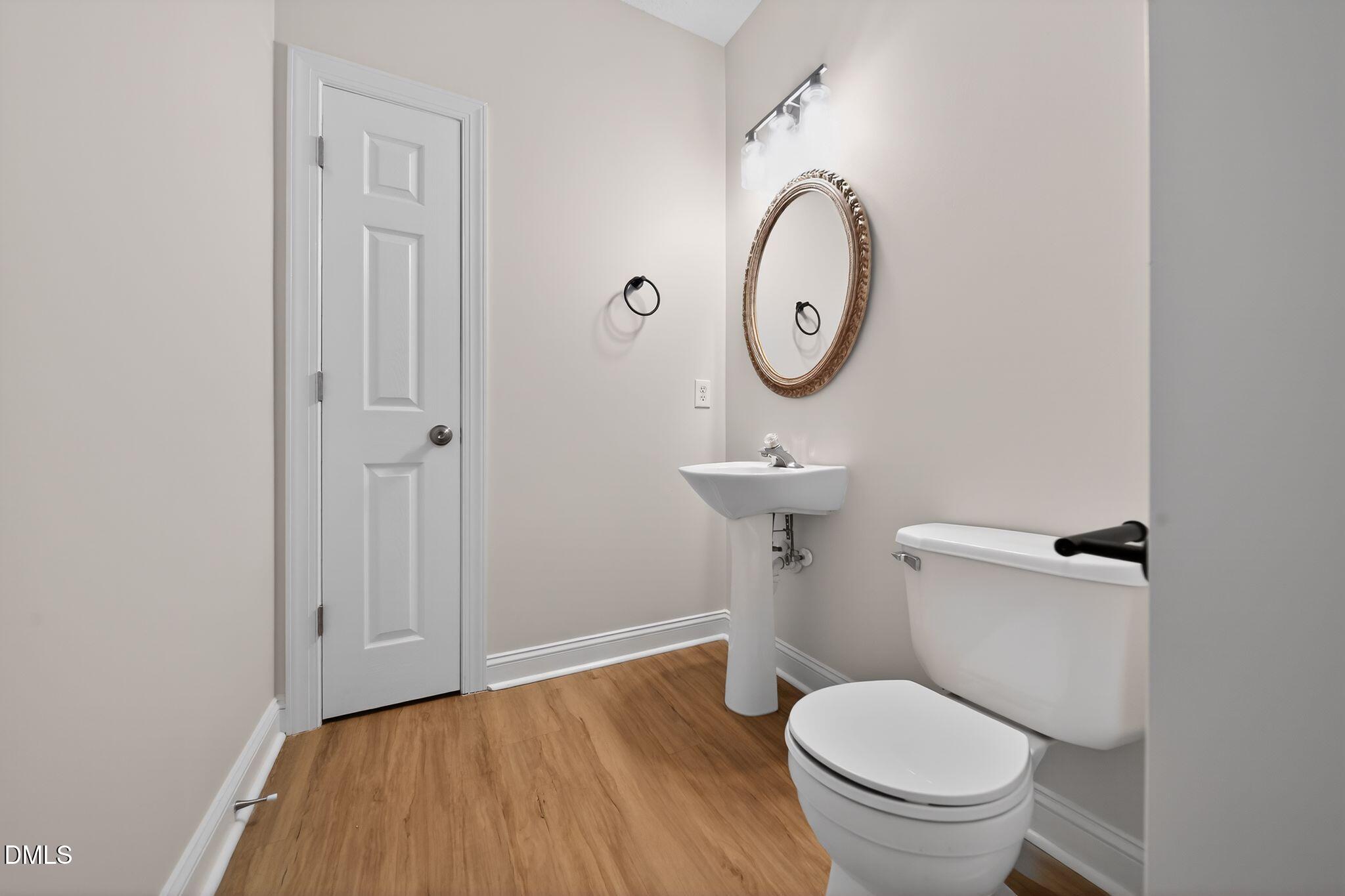 641 Commander Drive Wendell, NC 27591 - Photo 13 of 15 a bathroom with a toilet and a sink