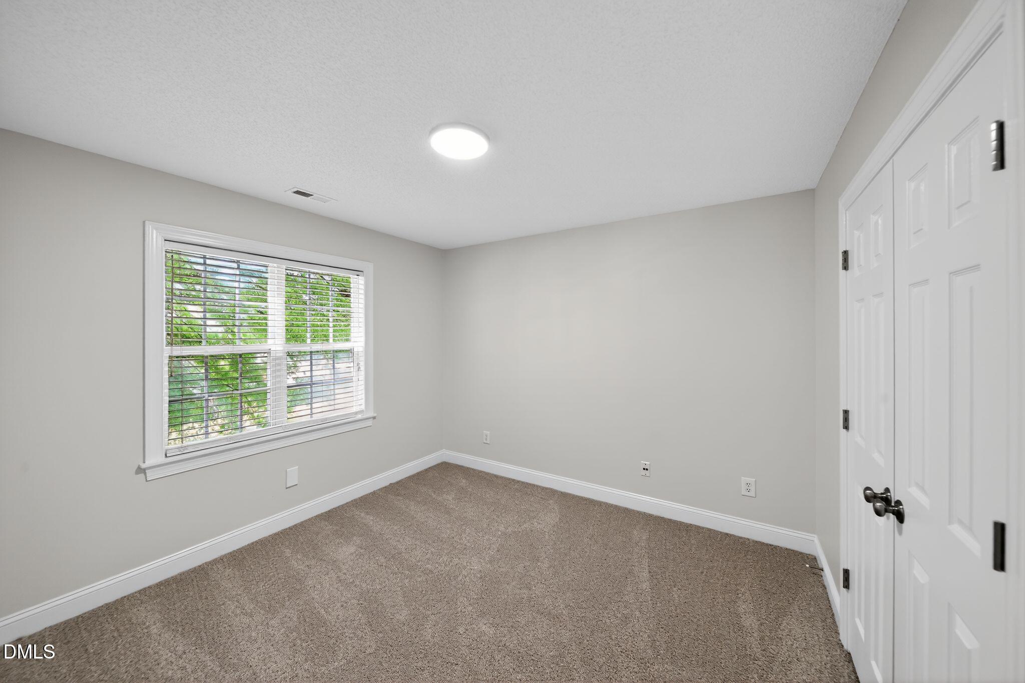 641 Commander Drive Wendell, NC 27591 - Photo 7 of 15 an empty room with a window