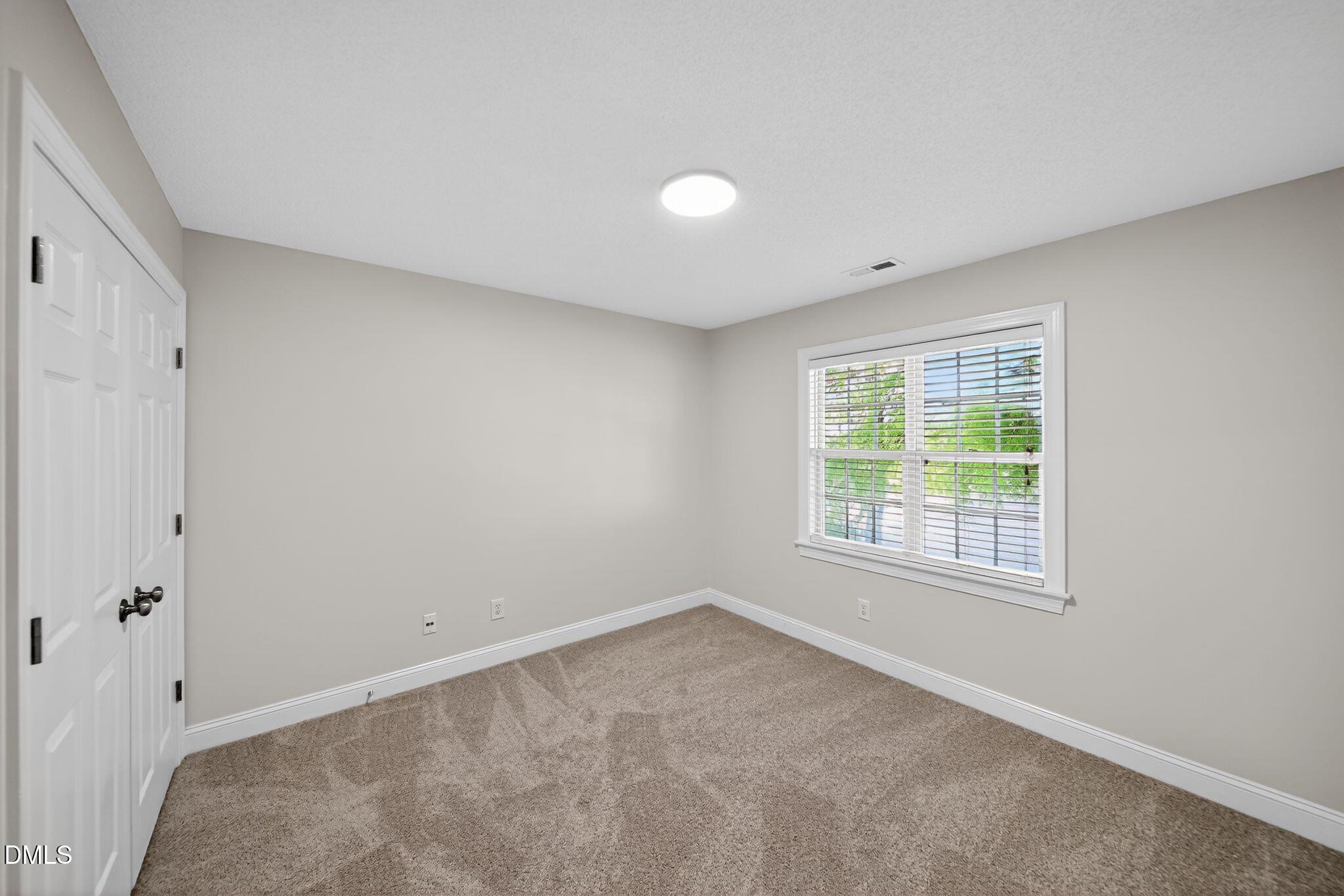 641 Commander Drive Wendell, NC 27591 - Photo 8 of 15 an empty room with a window