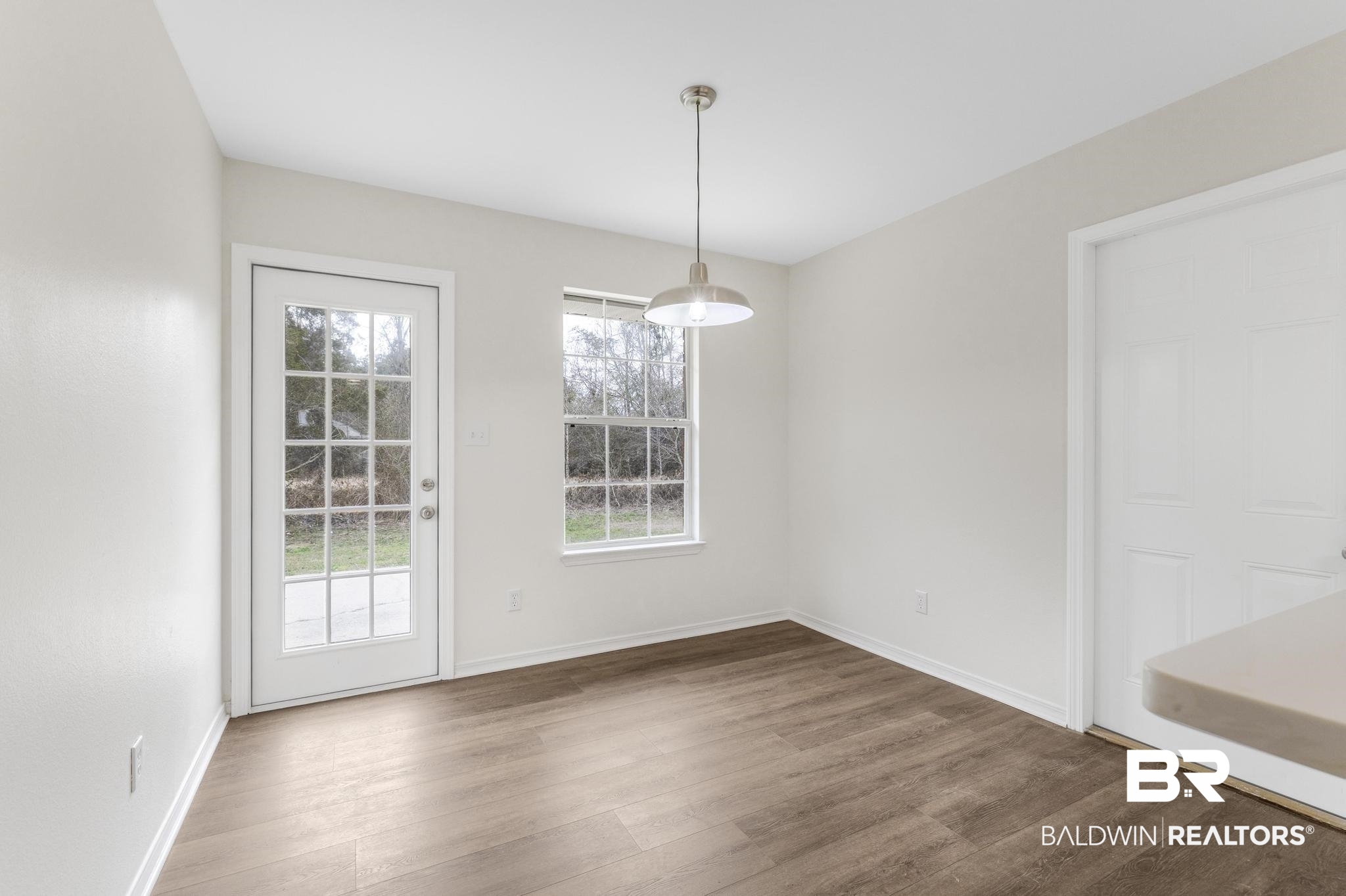 16330 Absalom Street Foley, AL 36535 - Photo 24 of 42 Unfurnished dining area featuring dark wood-type flooring