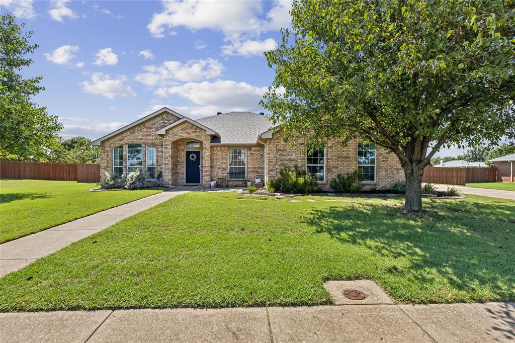 4633 Hunter Ridge Drive Midlothian, TX 76065 - Photo 1 of 1 a front view of a house with garden