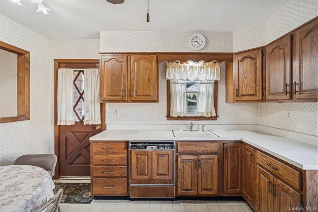 a kitchen with a cabinets and window