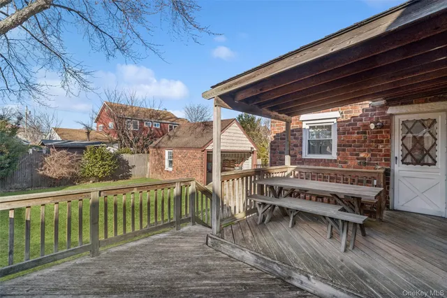 a view of a chair and table in the balcony