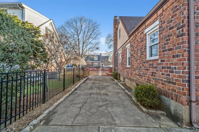 a view of a pathway both side of house