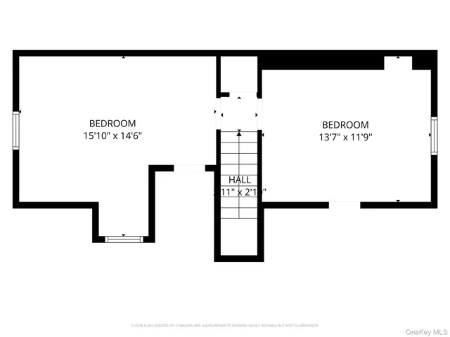 a picture of a bench in front of a wall