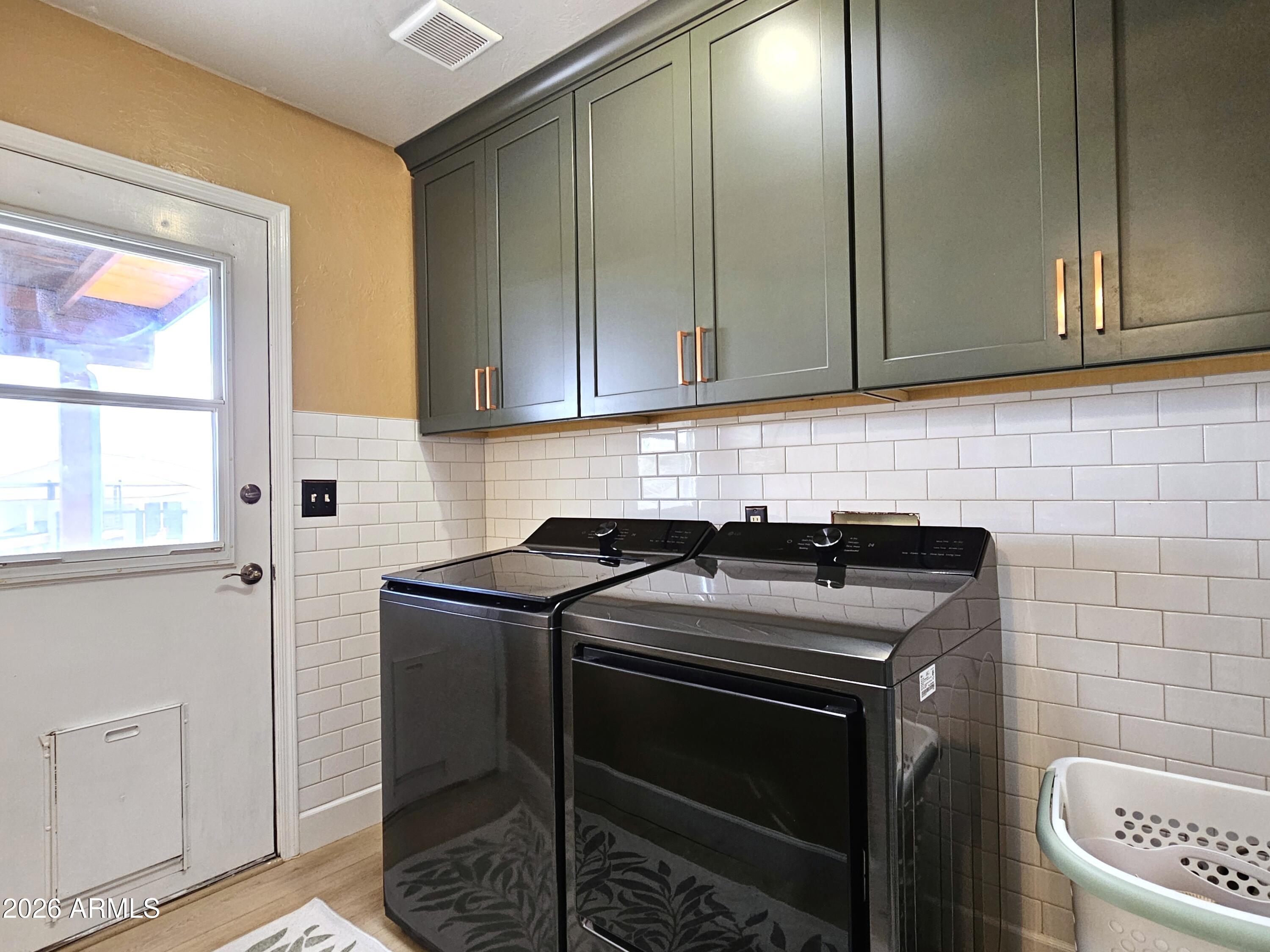 5705 South Wild Rose Road Hereford, AZ 85615 - Photo 17 of 39 a kitchen with granite countertop a sink stove and cabinets