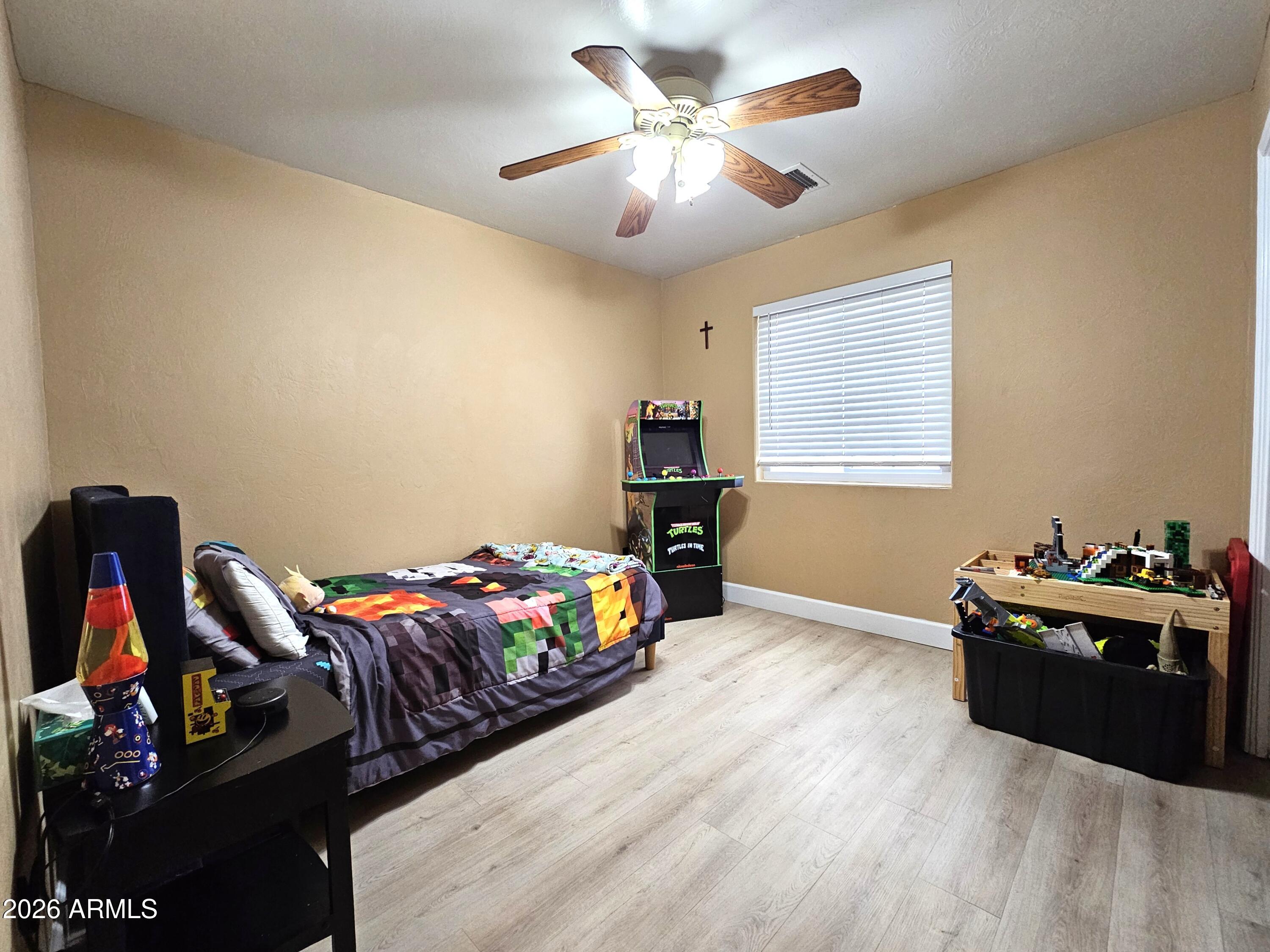 5705 South Wild Rose Road Hereford, AZ 85615 - Photo 21 of 39 a bedroom with furniture and a bed