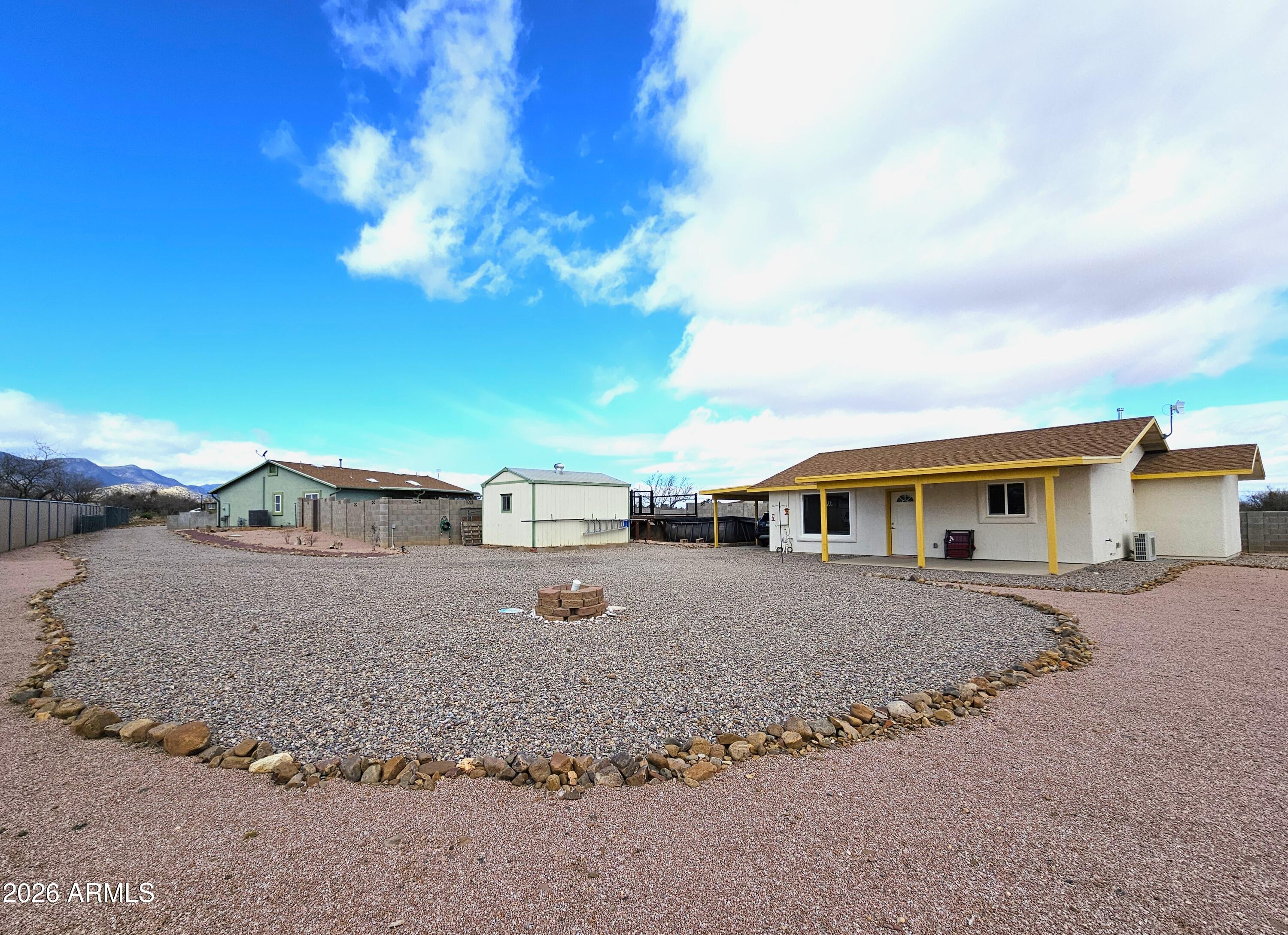 5705 South Wild Rose Road Hereford, AZ 85615 - Photo 30 of 39 a view of a house with a patio