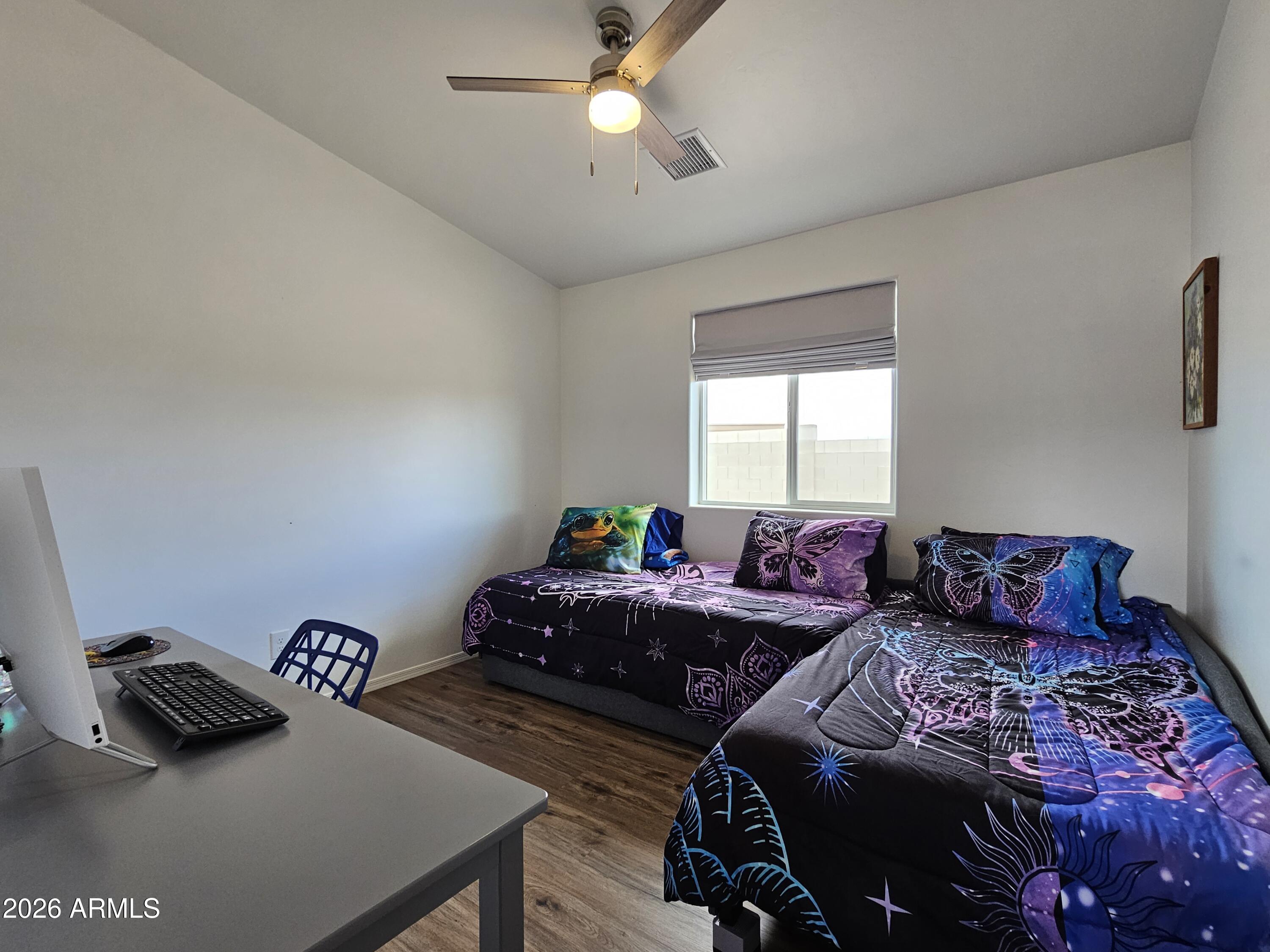 5705 South Wild Rose Road Hereford, AZ 85615 - Photo 37 of 39 a bedroom with two beds and a window