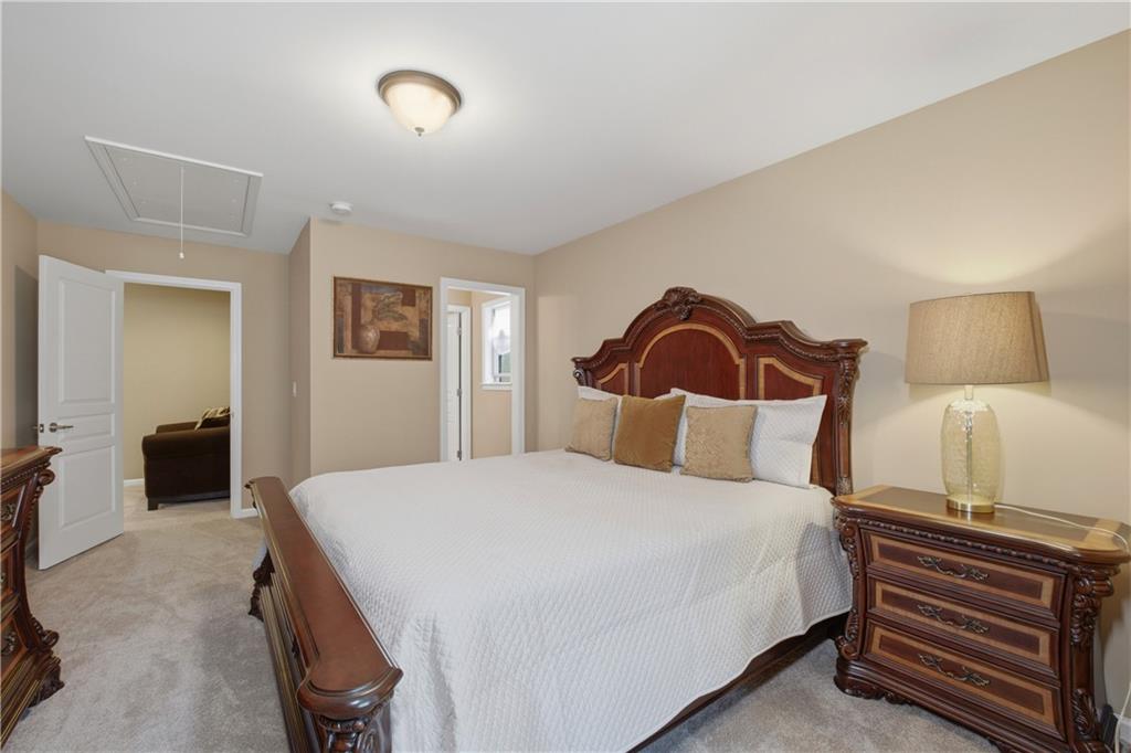 3880 Courson Street Marietta, GA 30066 - Photo 24 of 45 a bedroom with a bed and a view of bathroom