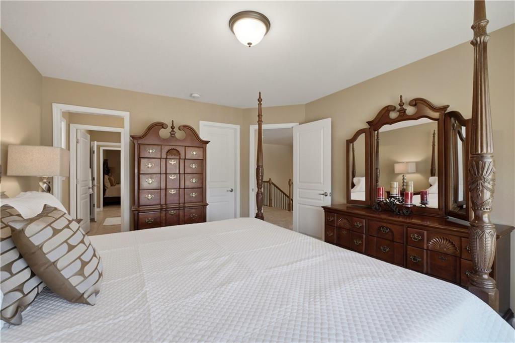 3880 Courson Street Marietta, GA 30066 - Photo 28 of 45 a bedroom with a bed and a dresser