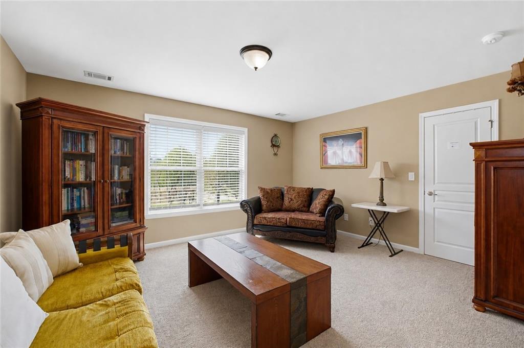 3880 Courson Street Marietta, GA 30066 - Photo 31 of 45 a living room with furniture and a window