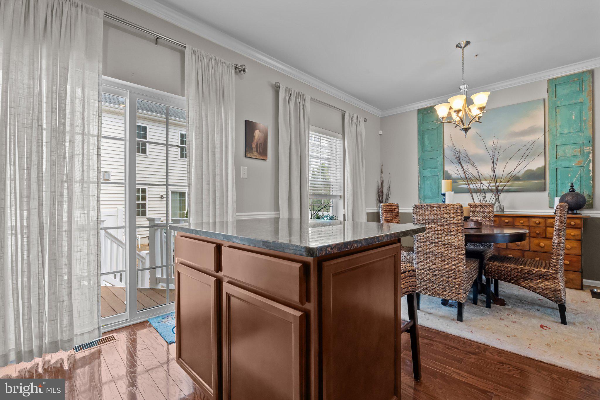 3799 Jacob Stout Road, Unit 9 Doylestown, PA 18902 - Photo 15 of 42 a view of a dining room with furniture window and wooden floor
