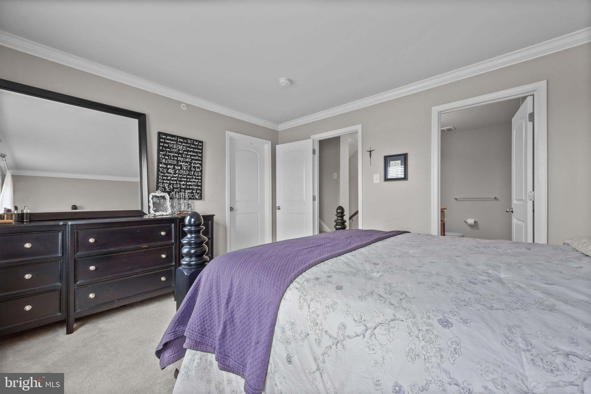 3799 Jacob Stout Road, Unit 9 Doylestown, PA 18902 - Photo 19 of 42 a bedroom with a bed and a dresser