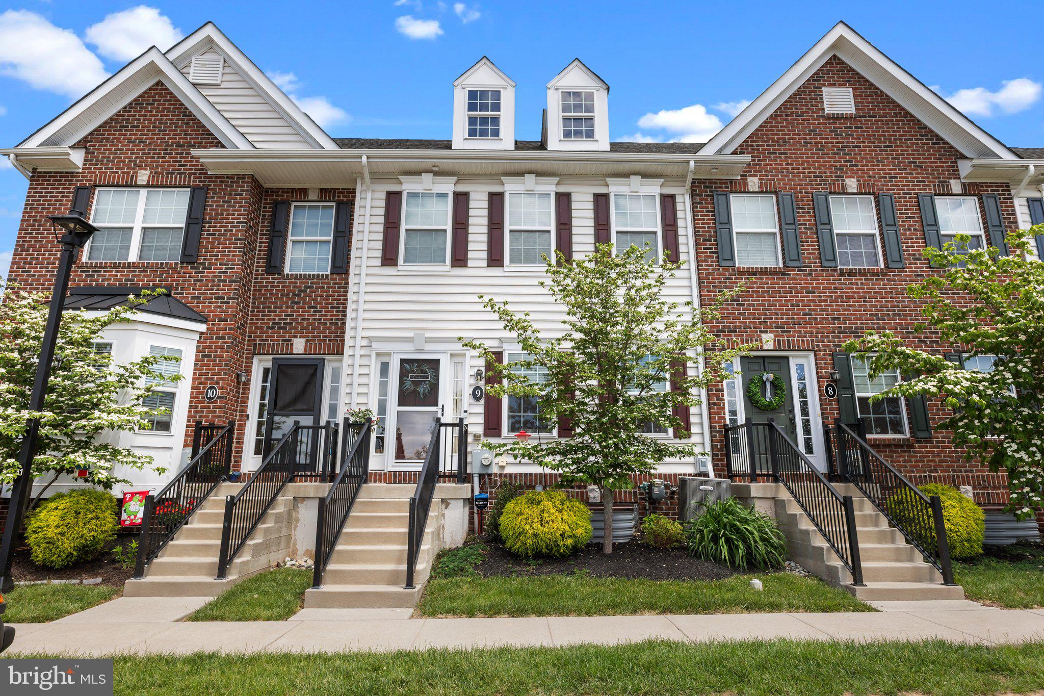 3799 Jacob Stout Road, Unit 9 Doylestown, PA 18902 - Photo 2 of 42 a front view of a house with garden