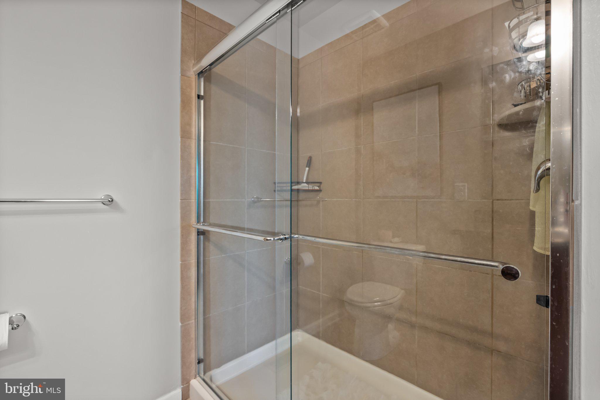 3799 Jacob Stout Road, Unit 9 Doylestown, PA 18902 - Photo 22 of 42 a bathroom that has a glass shower door