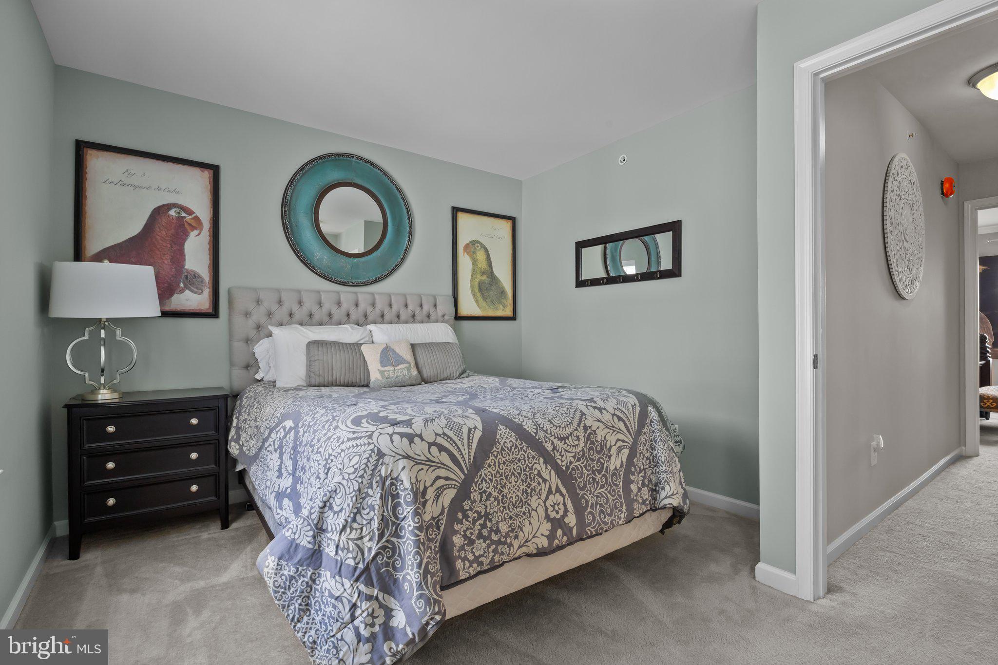 3799 Jacob Stout Road, Unit 9 Doylestown, PA 18902 - Photo 24 of 42 a bedroom with a bed and a lamp on dresser