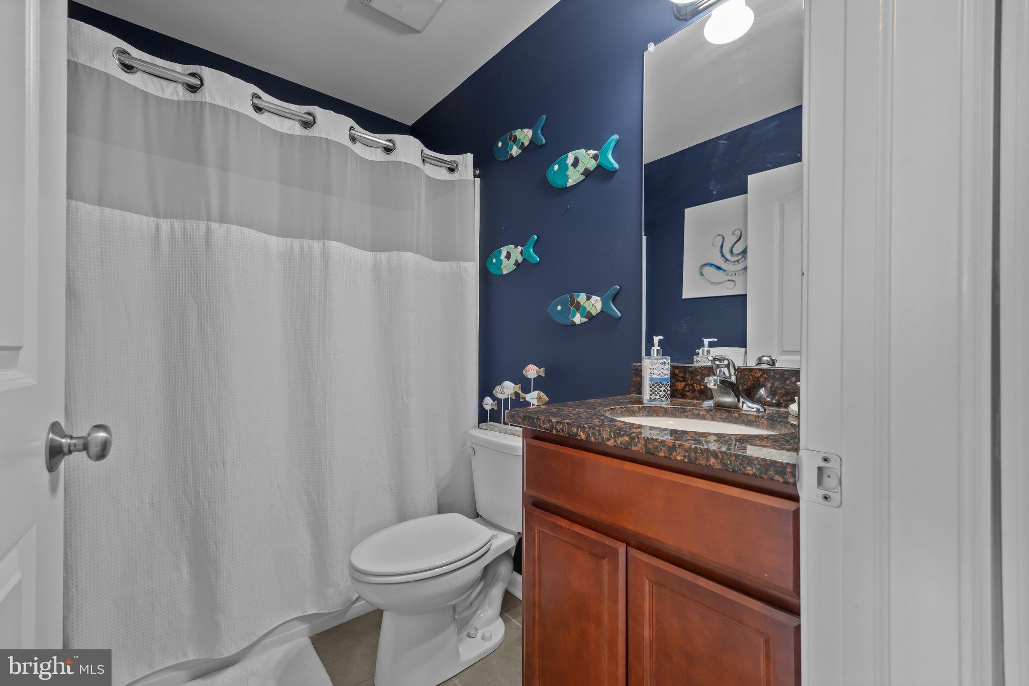 3799 Jacob Stout Road, Unit 9 Doylestown, PA 18902 - Photo 26 of 42 a bathroom with a granite countertop sink toilet and shower