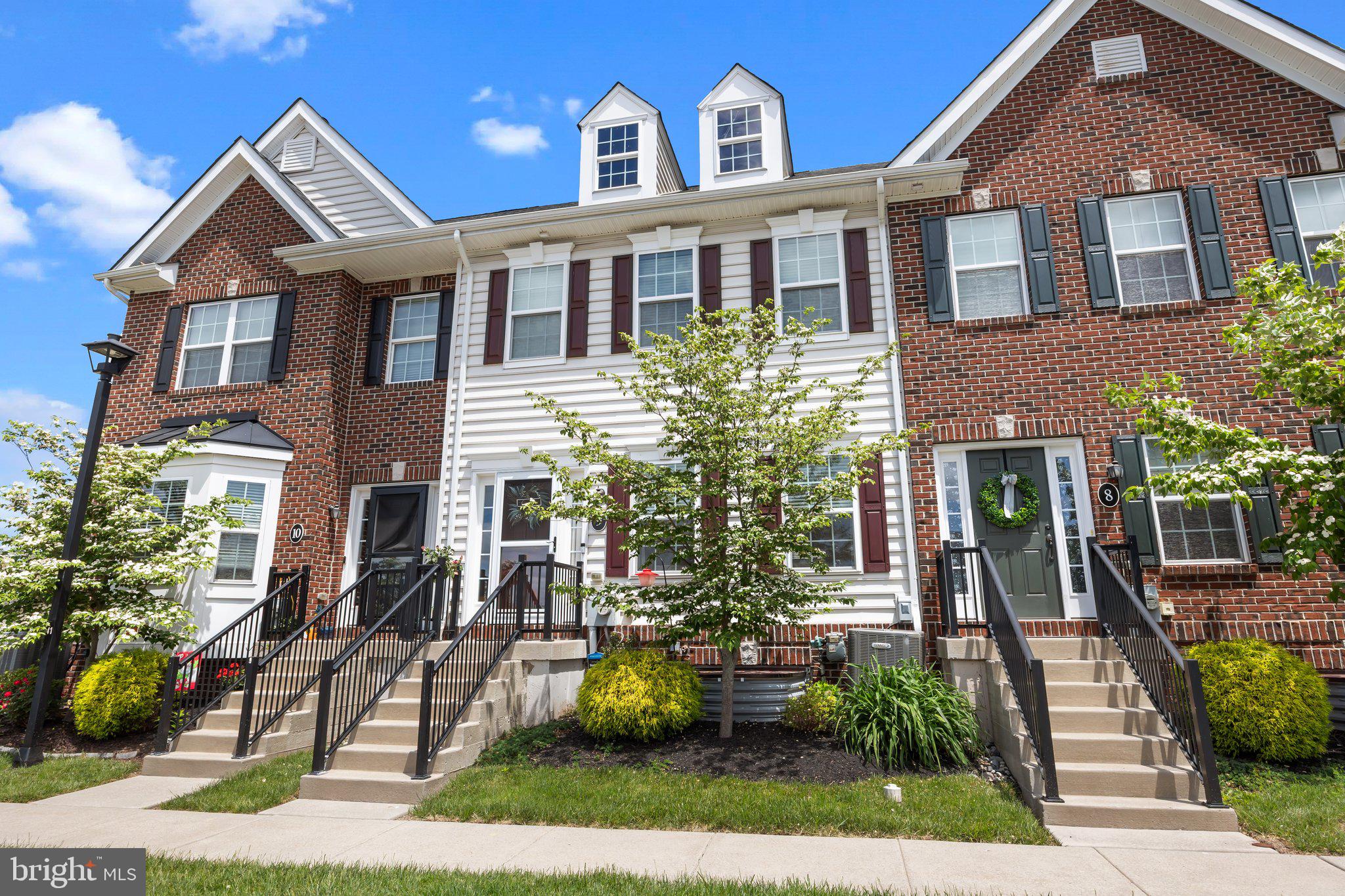 3799 Jacob Stout Road, Unit 9 Doylestown, PA 18902 - Photo 3 of 42 a front view of a house with a yard