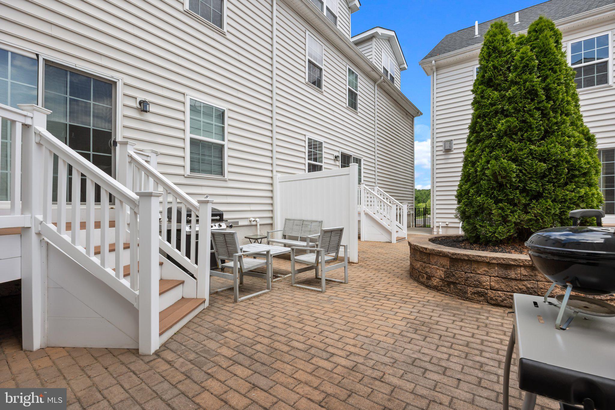 3799 Jacob Stout Road, Unit 9 Doylestown, PA 18902 - Photo 38 of 42 a view of a house with backyard and sitting area
