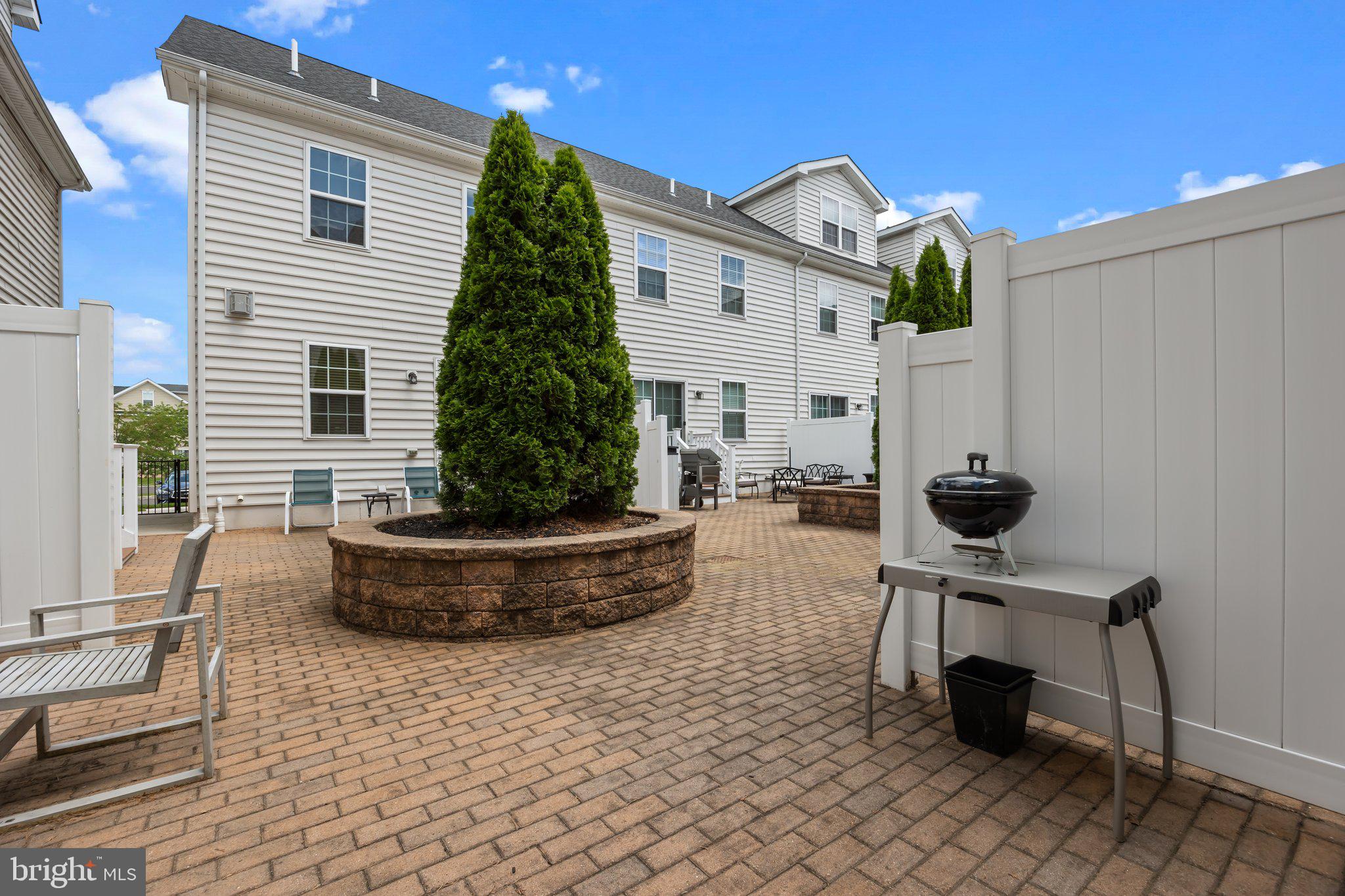 3799 Jacob Stout Road, Unit 9 Doylestown, PA 18902 - Photo 39 of 42 a view of a terrace with chairs and potted plants