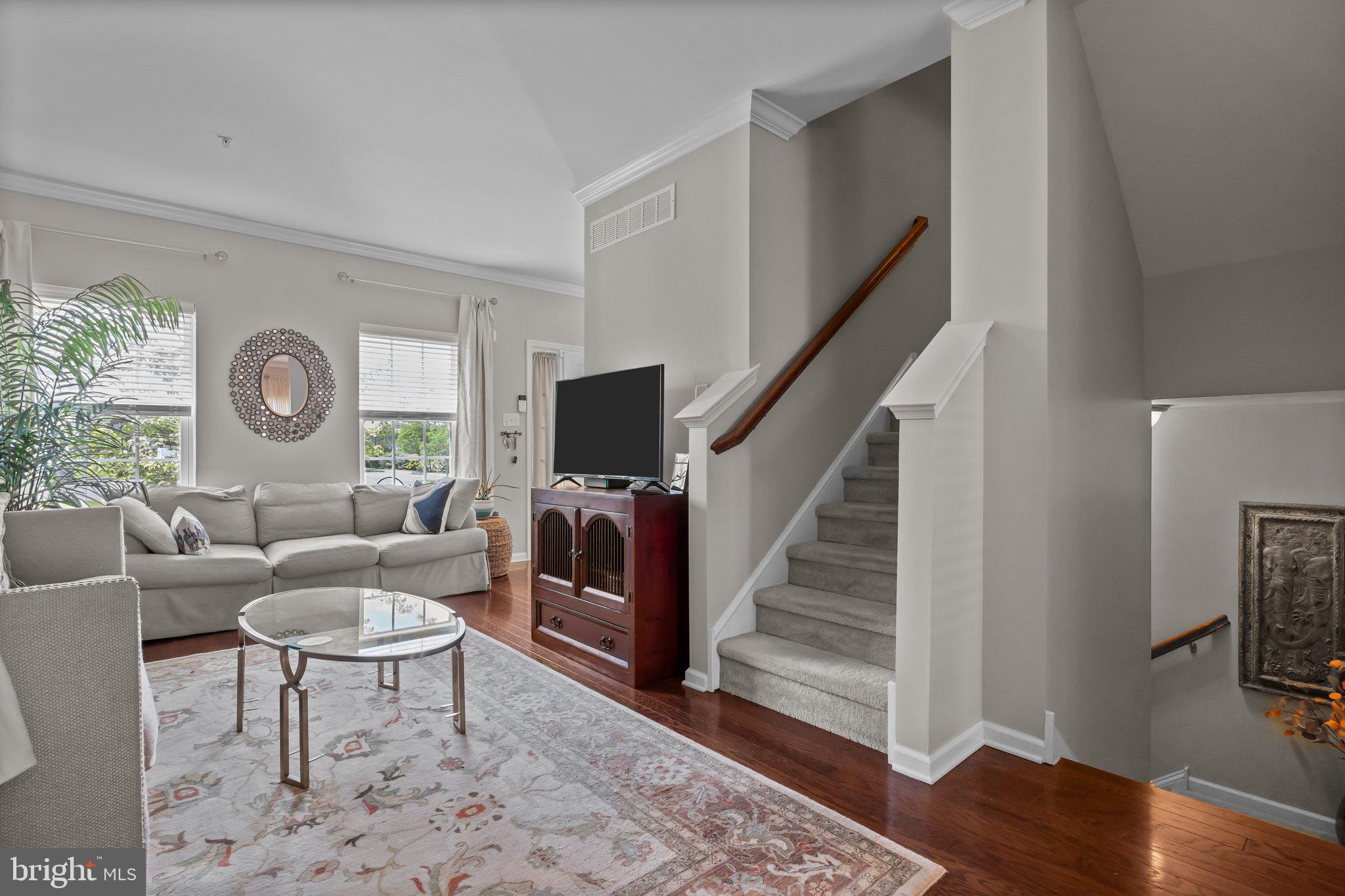 3799 Jacob Stout Road, Unit 9 Doylestown, PA 18902 - Photo 8 of 42 a living room with furniture and a flat screen tv