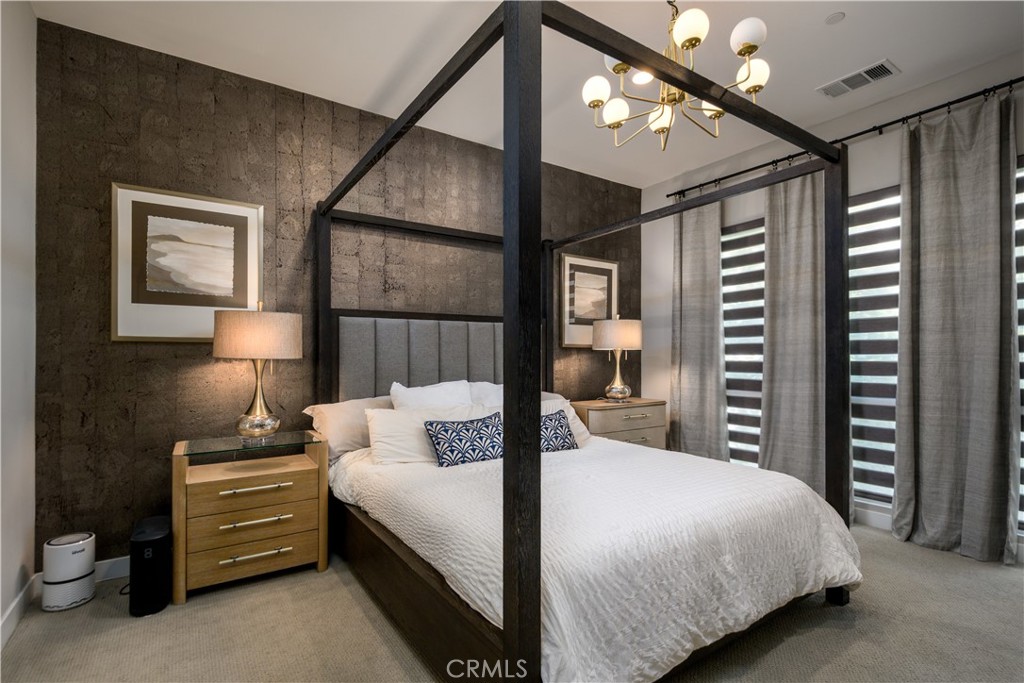 413 Transport Tustin, CA 92782 - Photo 16 of 47 a bedroom with a bed a lamp and a large closet